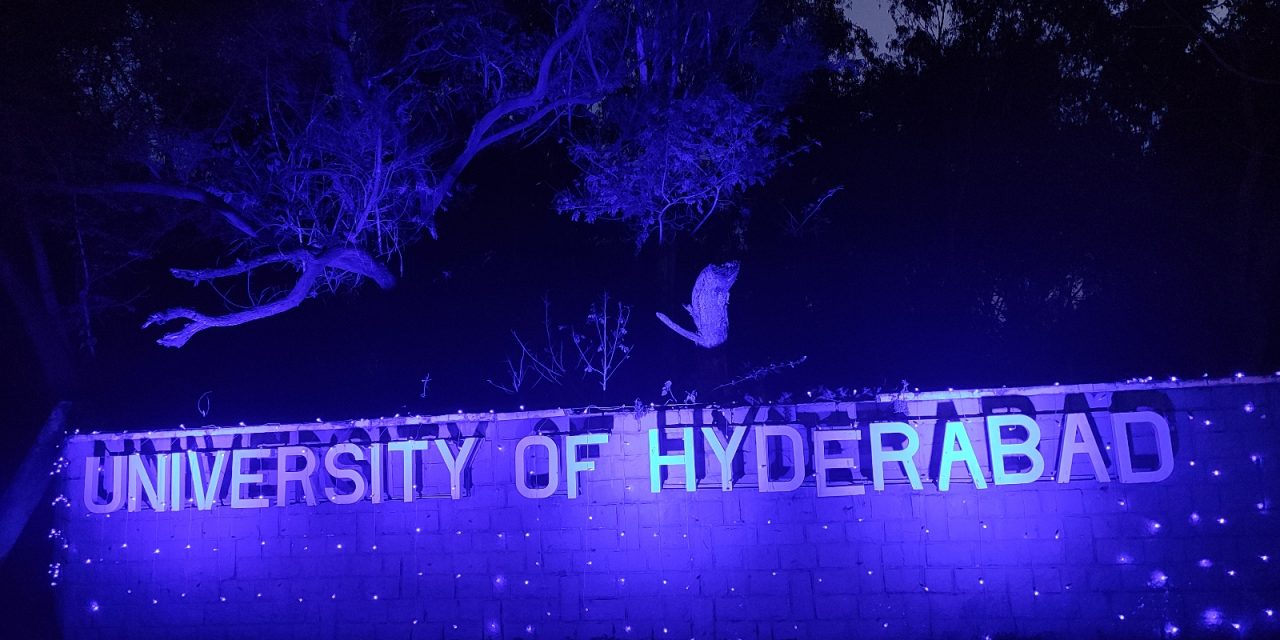 University of Hyderabad main-gate lit in blue